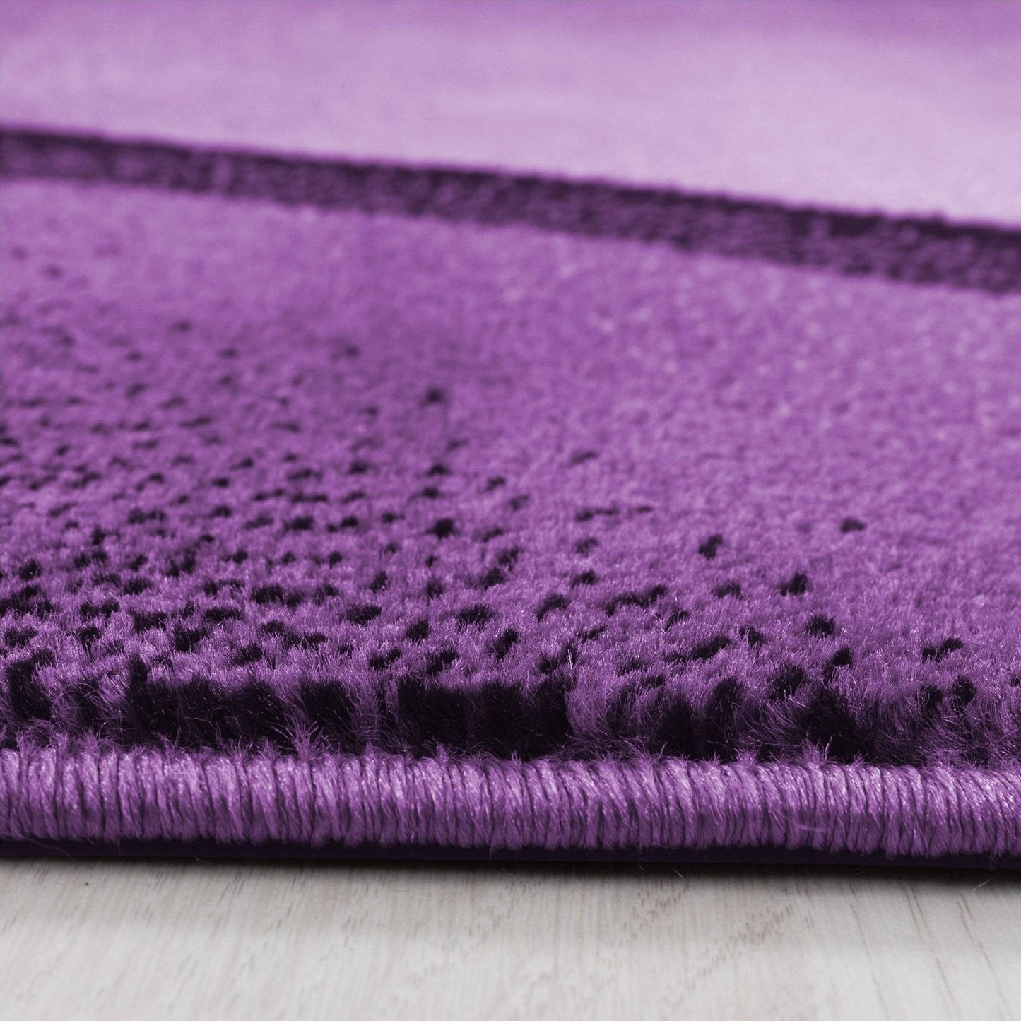 Designer Teppich Modern Kurzflor Abstrakt Wellen Optik Schwarz Lila Weiß