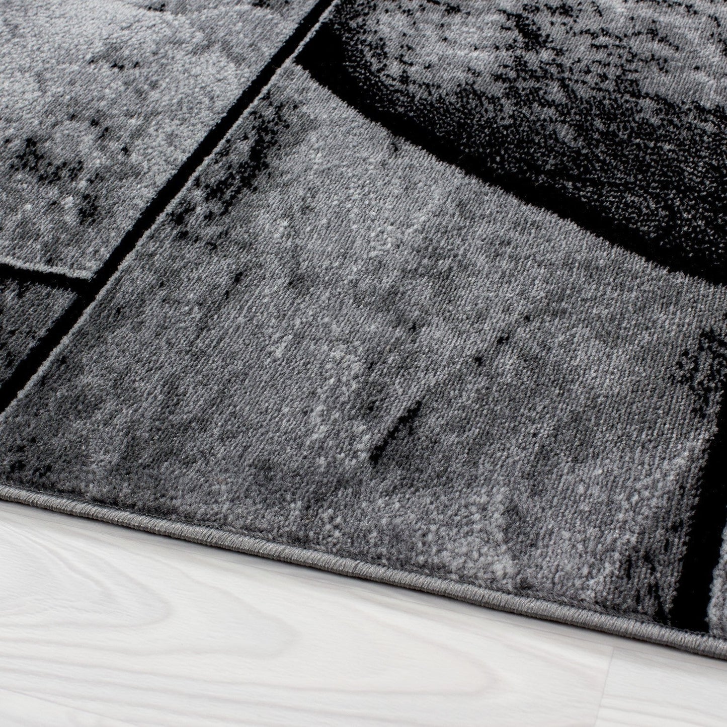 Moderner Designer Wohnzimmer Teppich mit Steinmotiv PARMA 9250 Schwarz-Grau